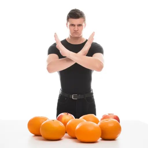 他既不喜欢苹果也不喜欢橙子。