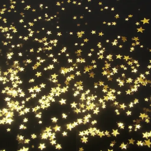 金色星星在黑色背景下闪闪发光。